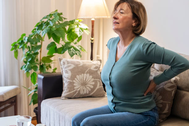 Senior woman with pain at home stock photo