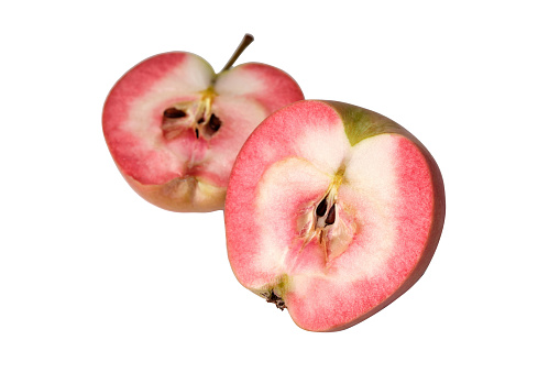 Hidden Rose Apples, pink apple inside. Two half of apple isolated on a white background
