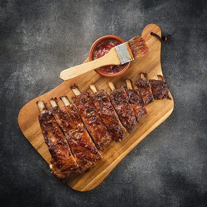 Barbecued and marinated sticky spare ribs. Grilled spare ribs. American style pork ribs. Top view.