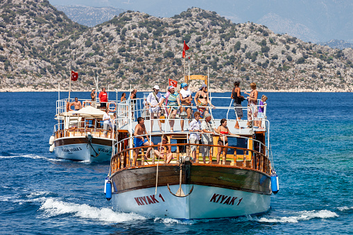 Kekova, Turkey - Aug 19, 2011: Tourist boat full of passengers on its way to Kekova in Turkey.