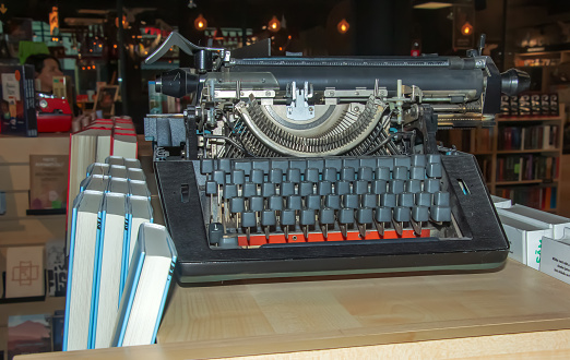 Stylish old typewriter in a bookstore. Close-up. Horizontal.
