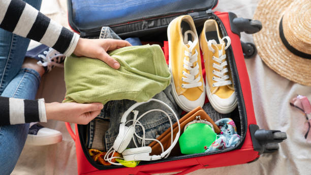 istock Preparation travel suitcase at home 1458275147