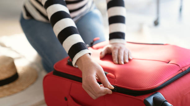 istock Preparation travel suitcase at home 1458275153