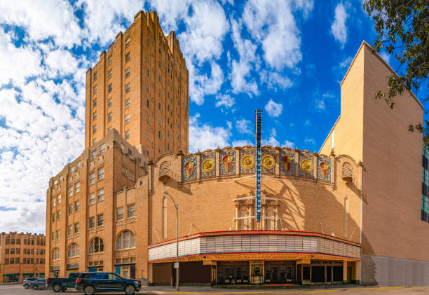 Abilene Texas city skyline and buildings and dramatic cloudscape at sunrise Abilene Texas city skyline and buildings and dramatic cloudscape at sunrise, street landscape with view of facades of Spanish Colonial Revival architecture of theater and hotel abilene texas stock pictures, royalty-free photos & images