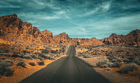 This is a photo of a road running through the desert.