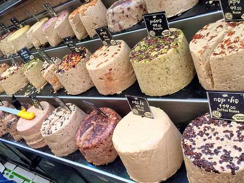 Traditional Israeli sweet halva with different flavors on a market in Jerusalem
