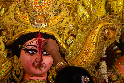 Bangali women worshipping Goddess durga and praying for her safe return during last day of Annual Durga Puja.