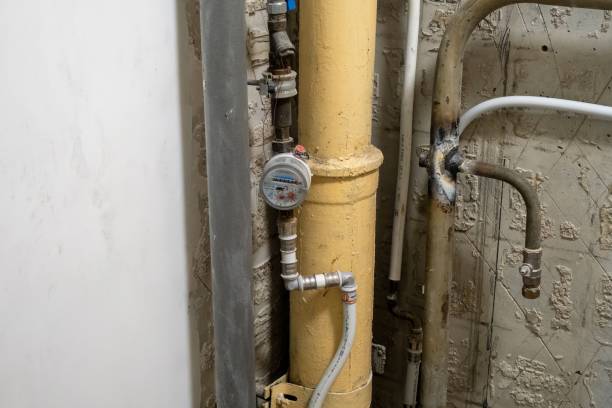istock Plumbing system in old premises. Water drainage circuit, Plumbing problems, Works related to leaking faucet, Dark tone, Selective focus. 1458288303