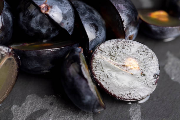 istock sweet ripe black grapes cut in half 1458290321