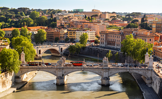 Panorama of Rome, Italy, Europe. Nice scenery bridges across Tiber River in Rome city center. Scenic view of Rome old buildings, beautiful landscape of Roma in summer. Travel, tourism in Rome.