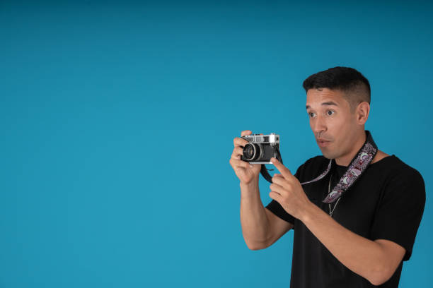 istock Nervous man taking pictures 1458296307