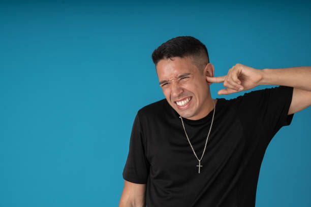 istock Man with ear pain 1458297516