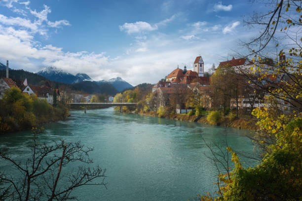 Fussen Skyline with Lech River, St. Mang Basilica and Allgau Alps - Fussen, Bavaria, Germany Fussen Skyline with Lech River, St. Mang Basilica and Allgau Alps - Fussen, Bavaria, Germany st mang stock pictures, royalty-free photos & images