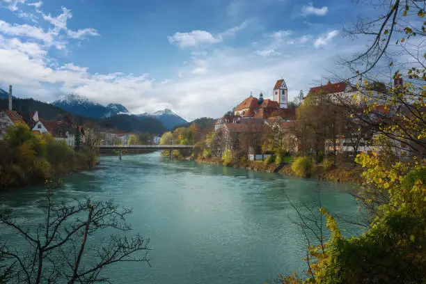 Fussen Skyline with Lech River, St. Mang Basilica and Allgau Alps - Fussen, Bavaria, Germany
