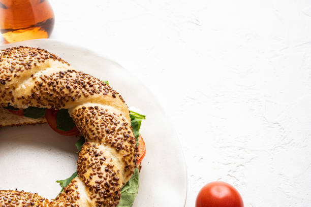 Bagel simit, Turkish breakfast, on white stone table background, with copy space for text