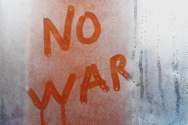 istock No war message on fogged window. Pacifist text, anti war concept. 1458301843