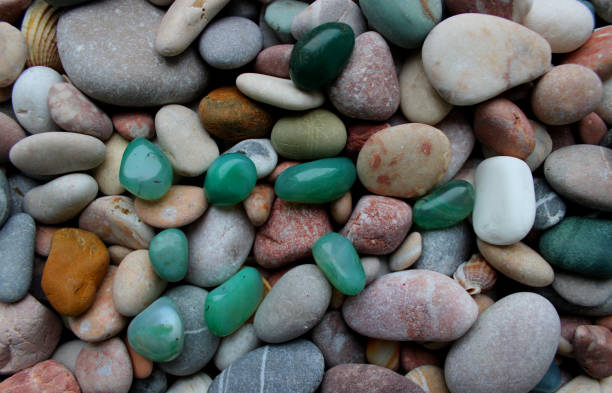 istock Green Semi-Precious Stones On A Colored Pebbles With Quartz Veins Texture Backgrounds 1458305954