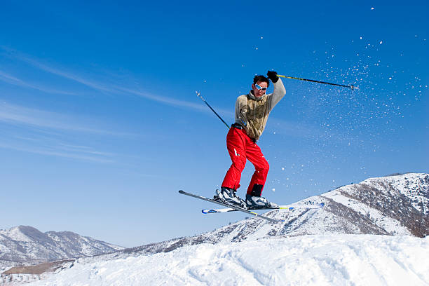 istock Snow Skier Jumping Against Blue Sky 145830666