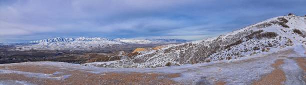 Maack Hill Sensei trail snowy mountain valley views in Lone Peak Wilderness Wasatch Rocky Mountains, Utah. USA. stock photo