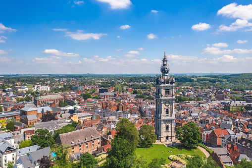 Aerial summer cityscape of the old town of Mons (Bergen). The Belfry of Mons (Beffroi) in the foreground. Wallonia, capital of Hainaut, Belgium.