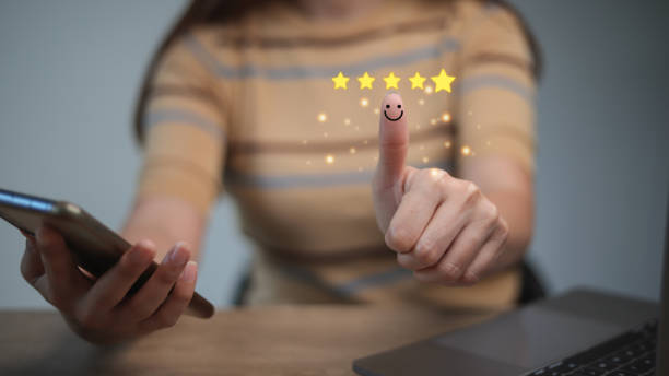 istock Customer satisfaction concept. Hand with thumb up Positive emotion smiley face icon and five star with copy space. 1458330036