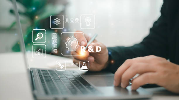istock R and D icon for Research and Development on laptop screen. Manage costs more efficiently. R and D innovation concept. 1458330338