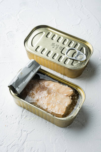 istock Canned salmon, fish preserves, in tin can, on white background 1458333289