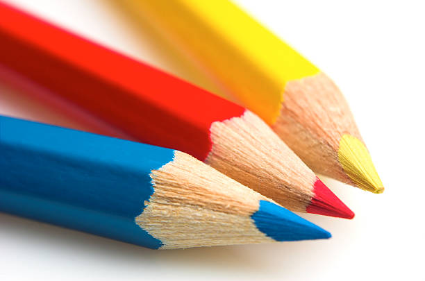 Blue, red and yellow crayons stock photo