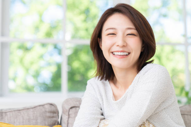 istock attractive asian woman relaxing 1458336806
