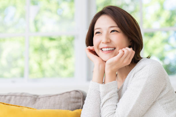 istock attractive asian woman relaxing 1458336816