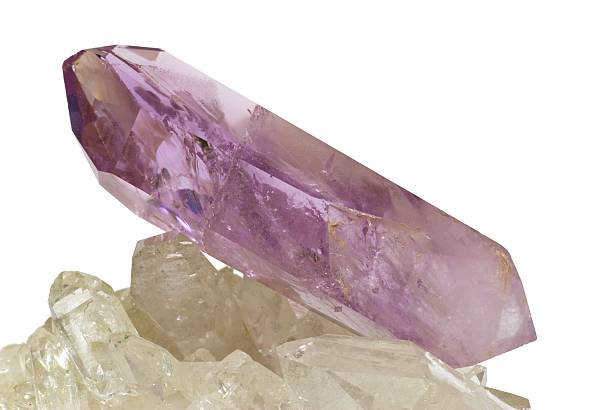 istock Amethyst crystal laid on quartz crystals 145833896
