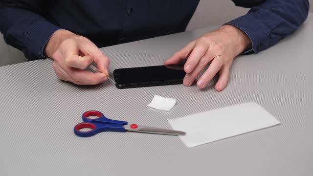 processing the edge of the protective glass surface for better contact with the smartphone.