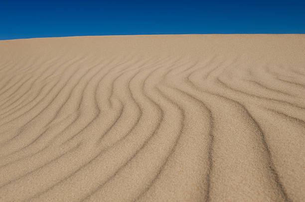 sand dune and sky stock photo