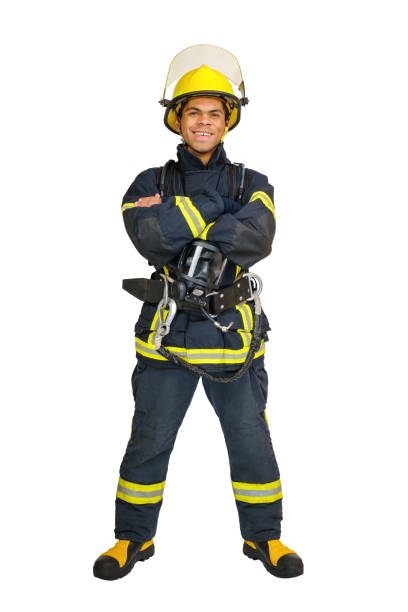 istock Fireman smiling and looks at the camera isolated on white 1458342575