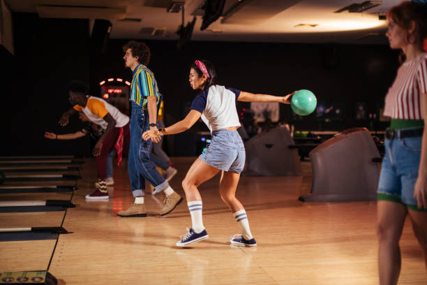 istock Friends bowling together 1458342785