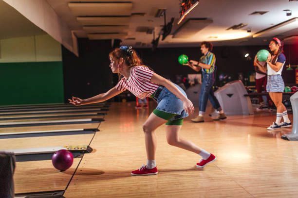 istock Friends playing bowling in club 1458342819
