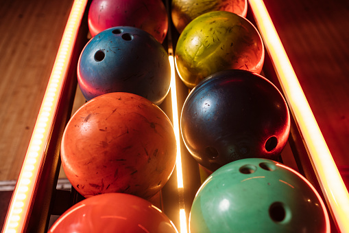 Photo of several colorful bowling balls