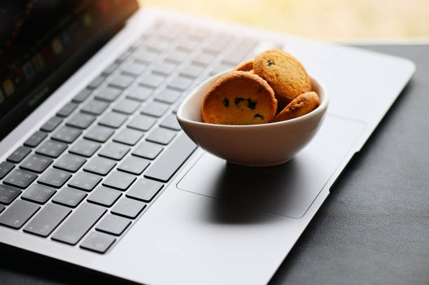 istock internet cookies internet browser cookies concept, mini cookies on keyboard computer laptop 1458345346