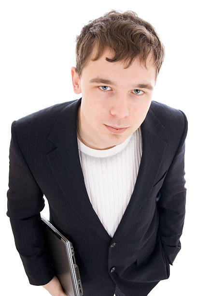 El joven hombre de negocios con ordenador portátil Aislado en blanco - foto de stock