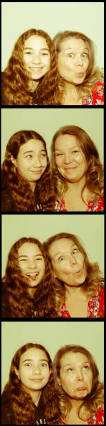 Four pictures of mother and daughter in Photo booth strip Four old pictures of mother and daughter in Photo booth strip on white background
Images are overexposed and a bit blurred like the photo booth images used to be.
People are making funny faces. id photo stock pictures, royalty-free photos & images