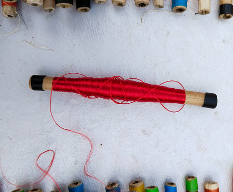 Muga Silk , one of the most expensive silk , is kept in water for the process of softening it. Cocoon made silk thread roll on Varanasi silk cloth