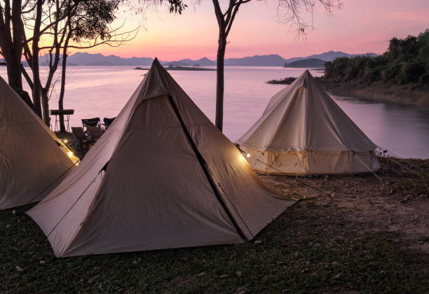 istock Camping tent in a camping in a forest by the river 1458358524