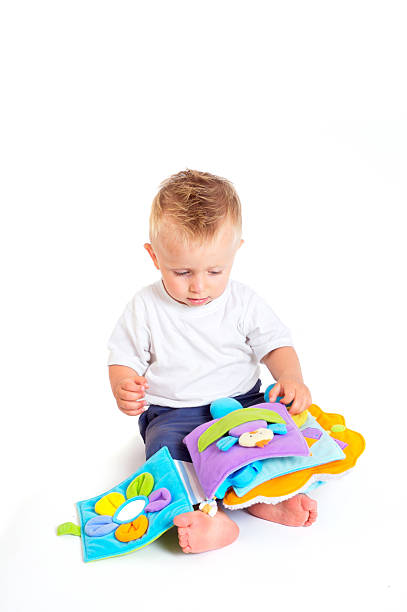 Baby plays with toys stock photo