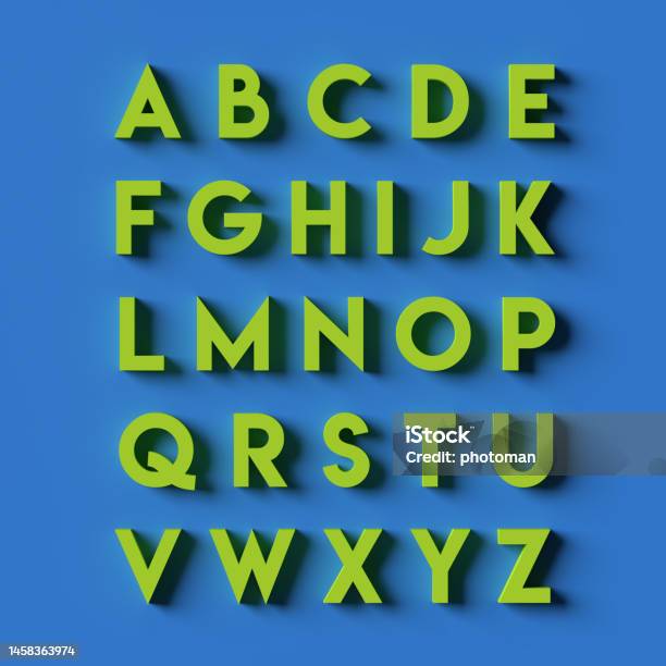 Alphabet In Green Capital Letters On Blue Surface Stock Photo - Download Image Now - Typescript, Creativity, Strength