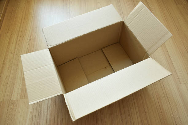 istock brown post box packaging put on wood floor 1458365082