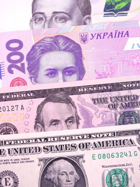 us dollars and ukrainian hryvnia - close up one dollar bill history finance imagens e fotografias de stock