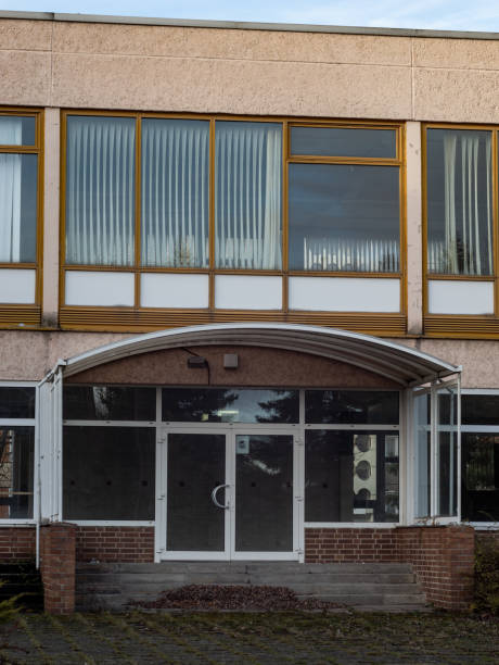istock Abandoned School Building Entrance 1458370976