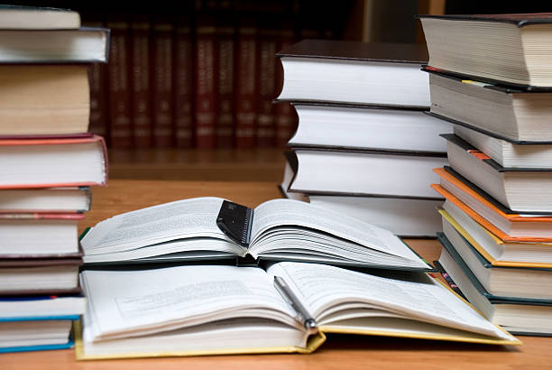 istock Lots of books at the library. 145837181