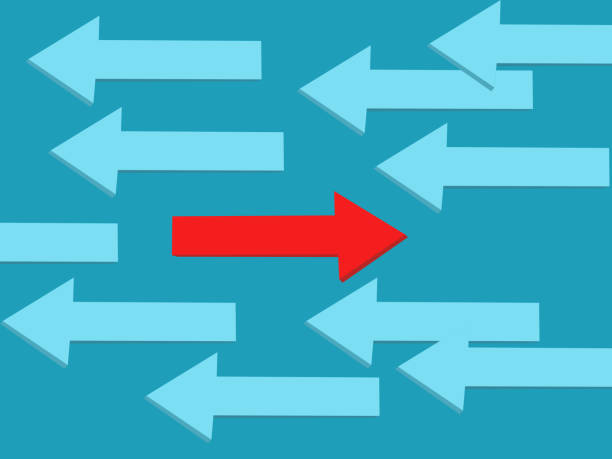 istock red arrow points in a unique direction. Dare to do the opposite of many people 1458376186