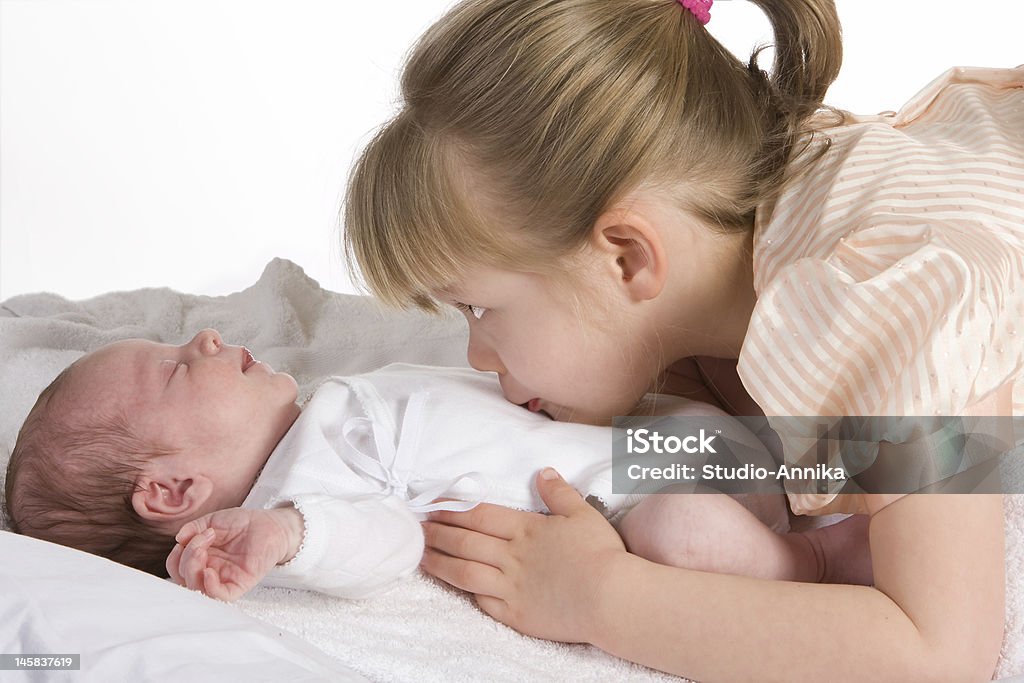 Sisterlove Little sister caressing her 15 days old brother Brother Stock Photo